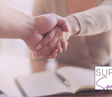 Image of two businesses shaking hands to represent business owners working with business services.