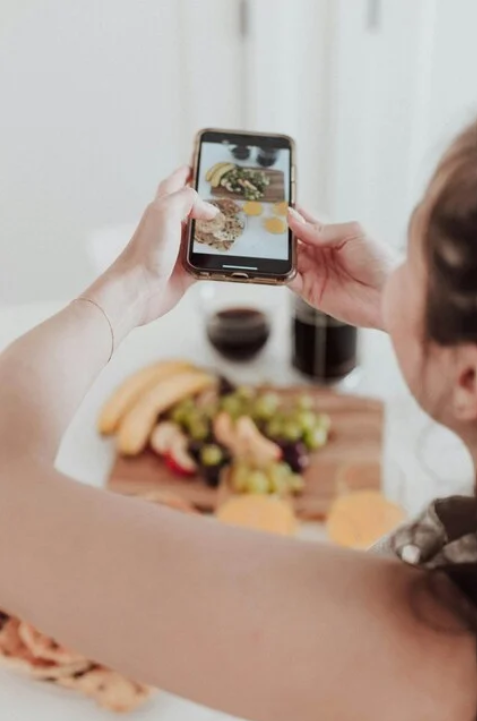 Someone taking a picture for social media content