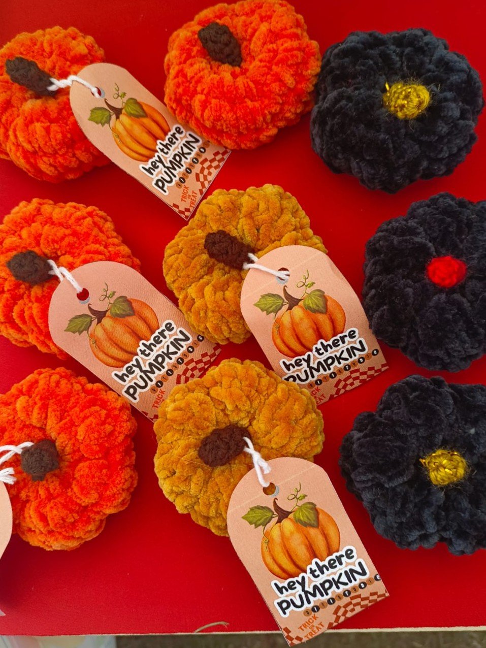 Pumkins that are crocheted.