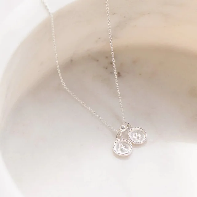 Image of necklace with initials made by Lucy Ashton Jewellery