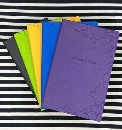 image of note books in various colours by the plus planner