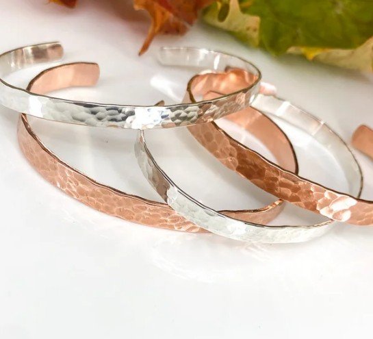 Image of hammered bangles in copper and silver