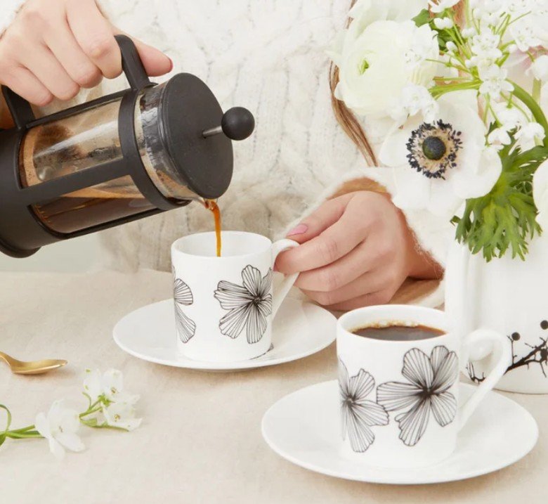Image of cup and saucer with cosmos flowers on made by Jinny Ngui Design