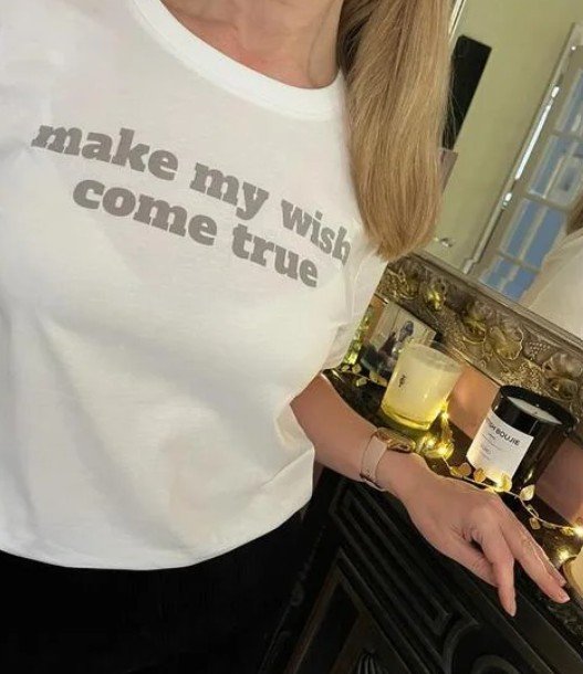 Image of woman wearing a personalised tshirt made by All About the Words